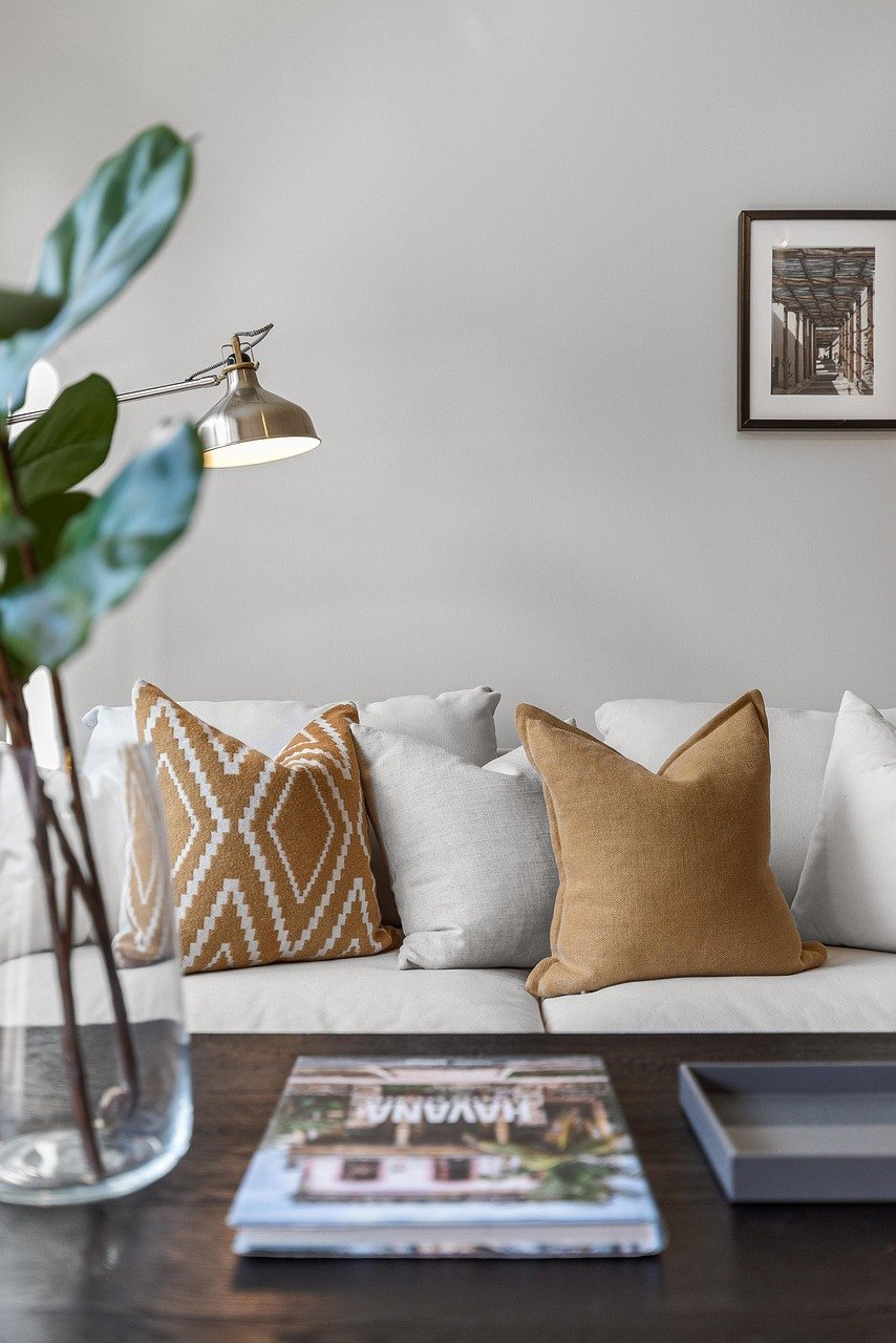 gold pillow sofa in living room photo