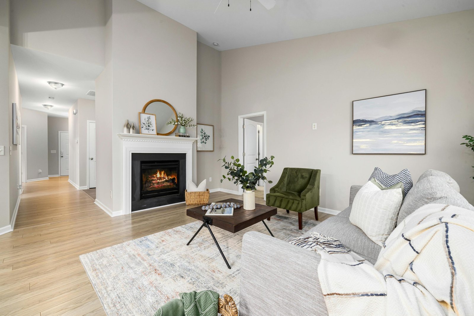 Elegant modern living room featuring a fireplace, cozy couch, and stylish decor.